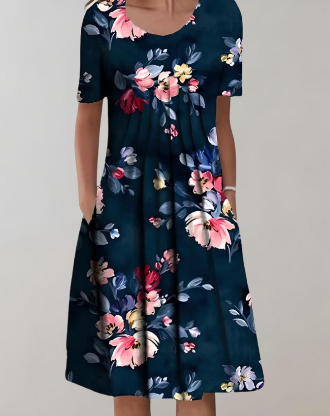 Women's floral midi dress with short sleeves and practical pockets, perfect for summer casual wear.