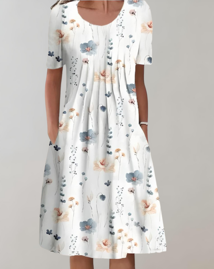 Stylish women's summer floral midi dress featuring short sleeves & functional pockets for a chic, casual look.