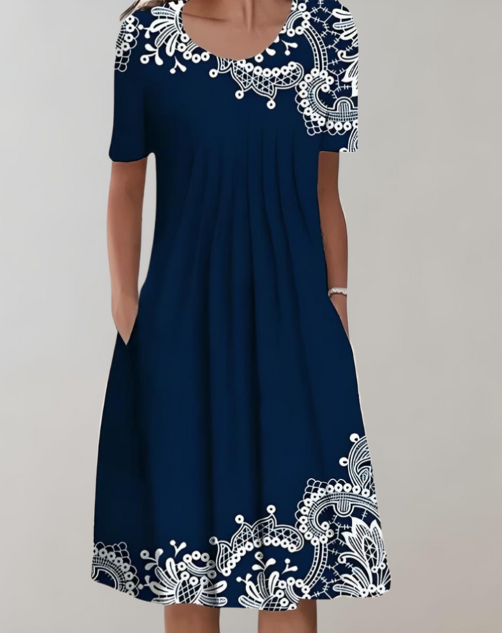 Comfortable women's floral midi dress with short sleeves and pockets, a versatile and essential casual summer dress.