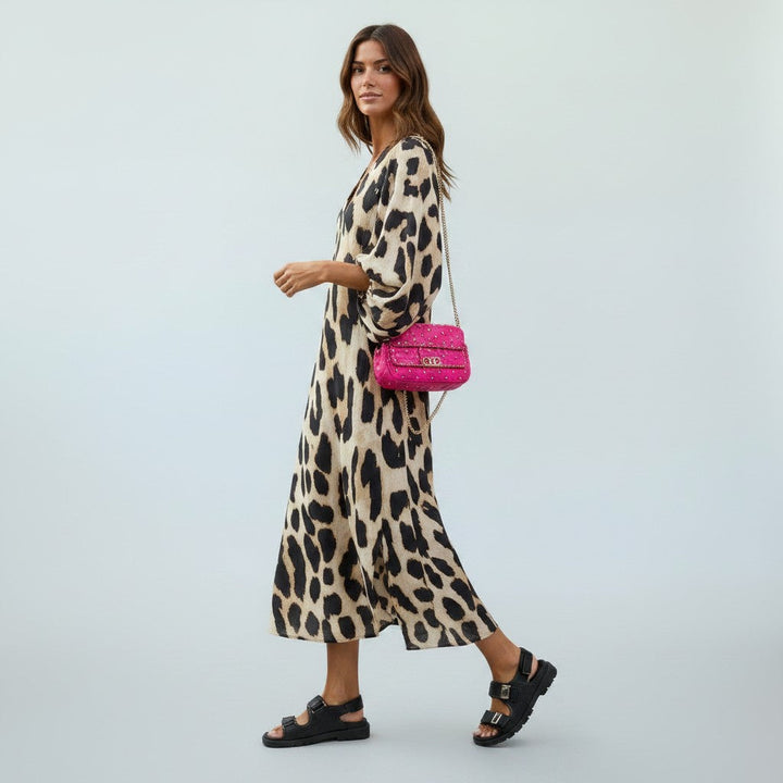 Stylish women's leopard print midi dress, elegant & comfortable, designed with a flattering silhouette.