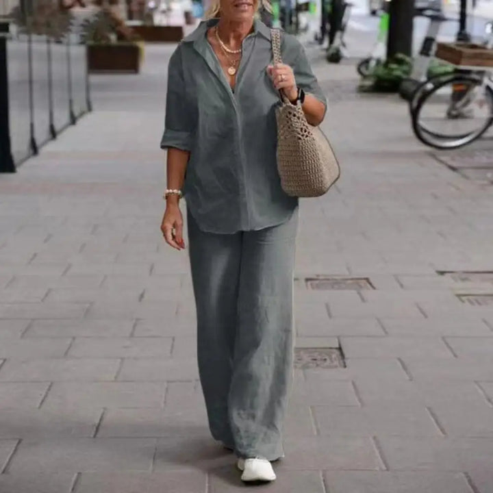 Stylish women's linen two-piece outfit: long sleeve shirt & wide-leg trousers for effortless elegance.