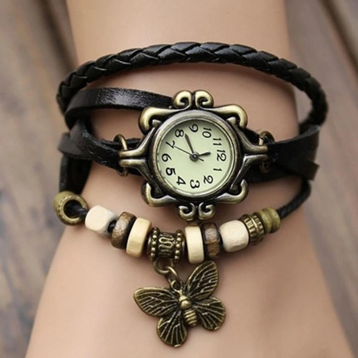 Elegant women's quartz watch, featuring a delicate floral design and intricate vintage style bracelet.