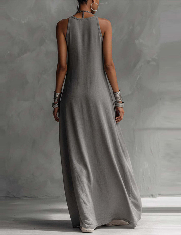 Halter neck sleeveless maxi dress for women, featuring a chic asymmetric flow and stylish color block pattern.