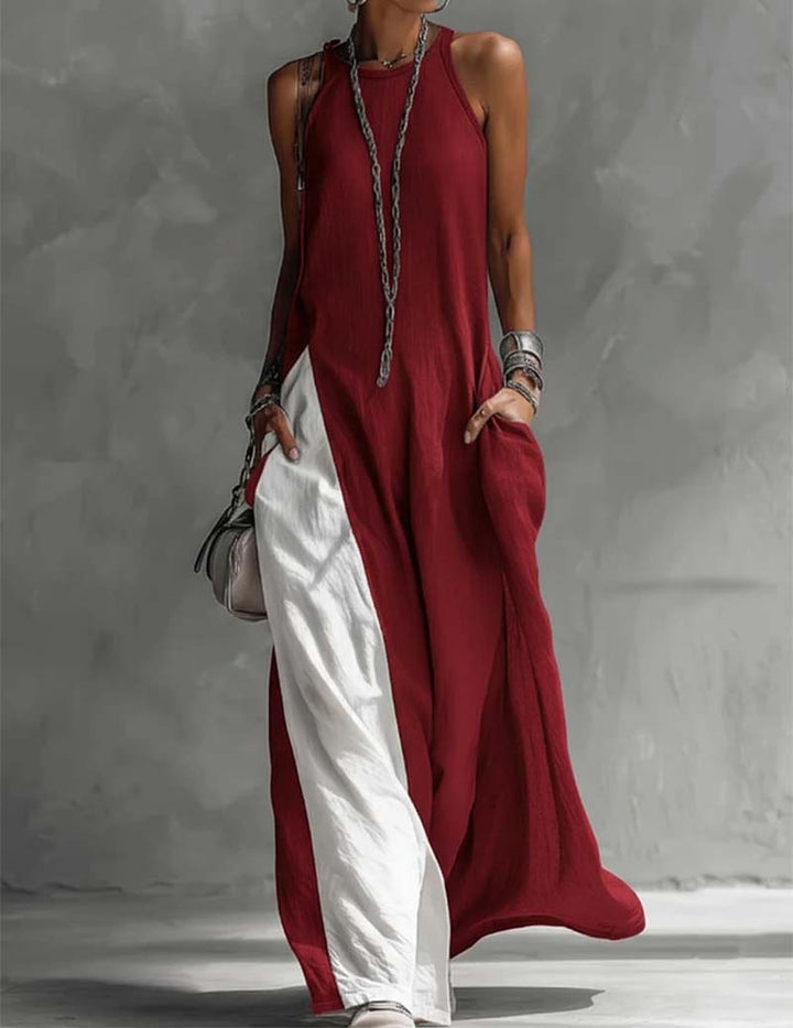 Elegant women's asymmetric flow maxi dress, sleeveless with a halter neck and artistic color block detail.
