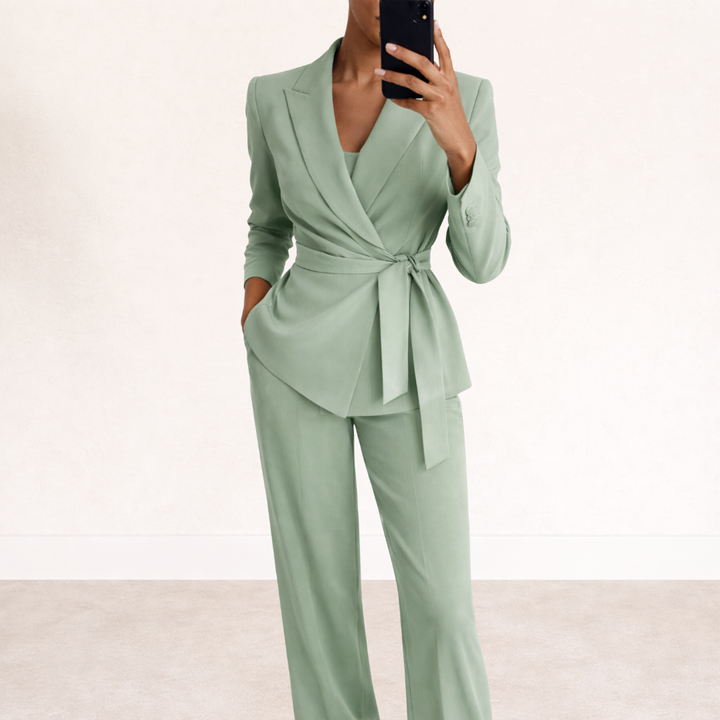 Versatile women's two-piece suit with tie-waist blazer and wide-leg pants, suitable for office or evening wear.