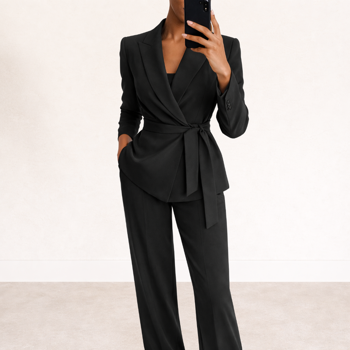 Sophisticated women's blazer with a tie waist, paired with wide leg pants, creating a polished and professional suit.