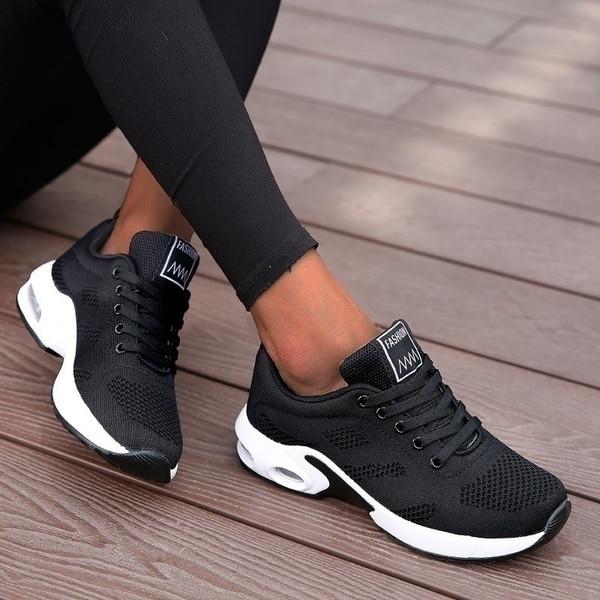 Comfortable women's athletic sneakers, ideal for walking, running, and everyday wear.