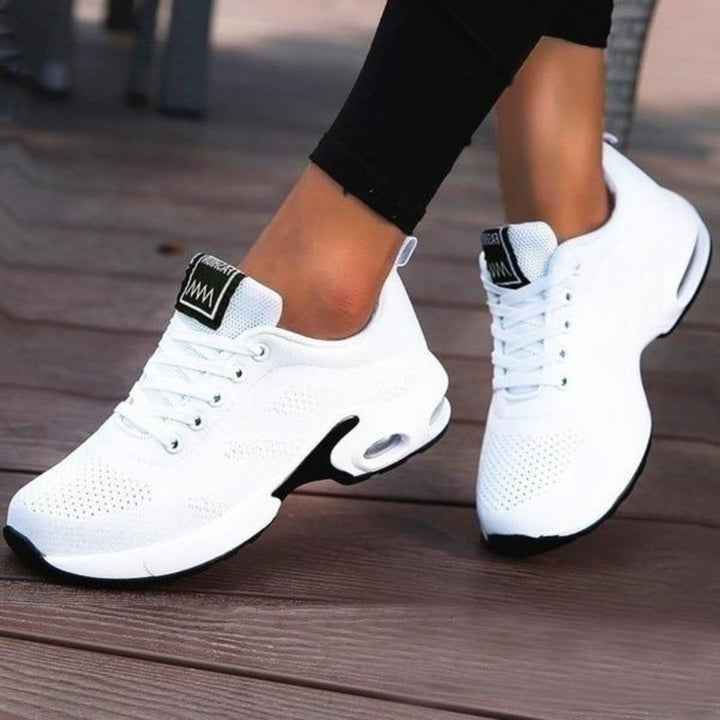 Women's activewear running shoes, featuring a breathable design for peak performance.