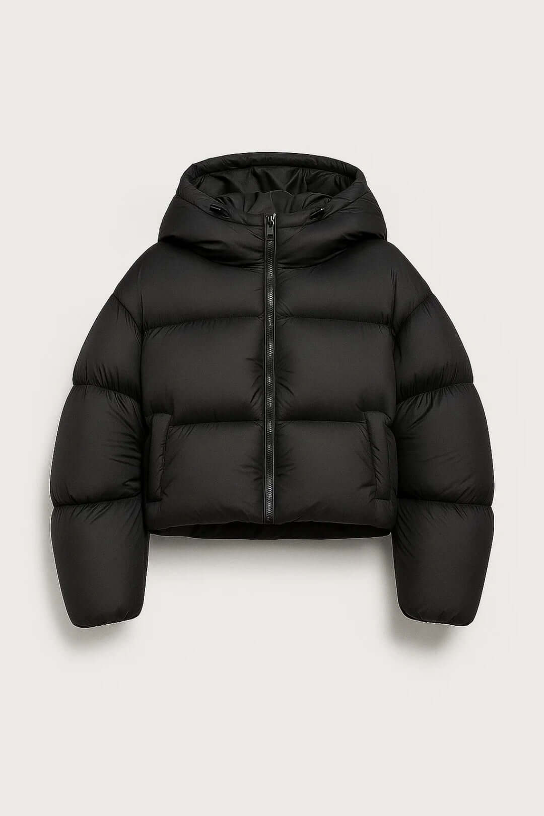 Warm women's black hooded short puffer jacket. Padded winter coat for cold weather, perfect casual outerwear.