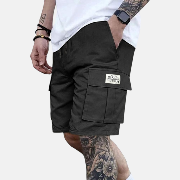 Casual men's summer cargo shorts with practical pockets, loose fit, and elastic waist for comfortable vacation style.