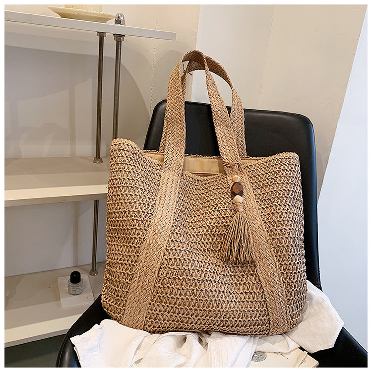 Stylish women's casual straw tote bag, perfect for summer beach trips & everyday fashion. Lightweight woven accessory.