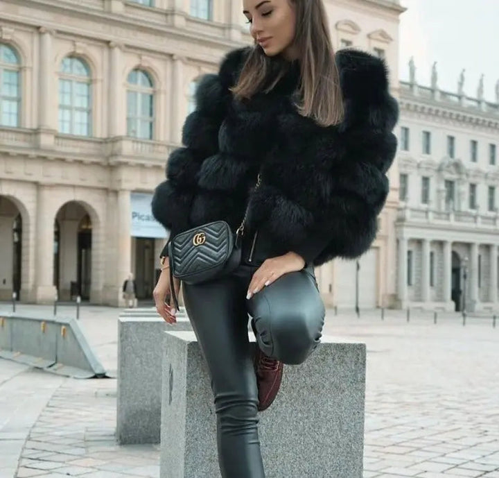 Stylish women's elegant winter coat, a chic fashion jacket offering warmth and luxurious feel.