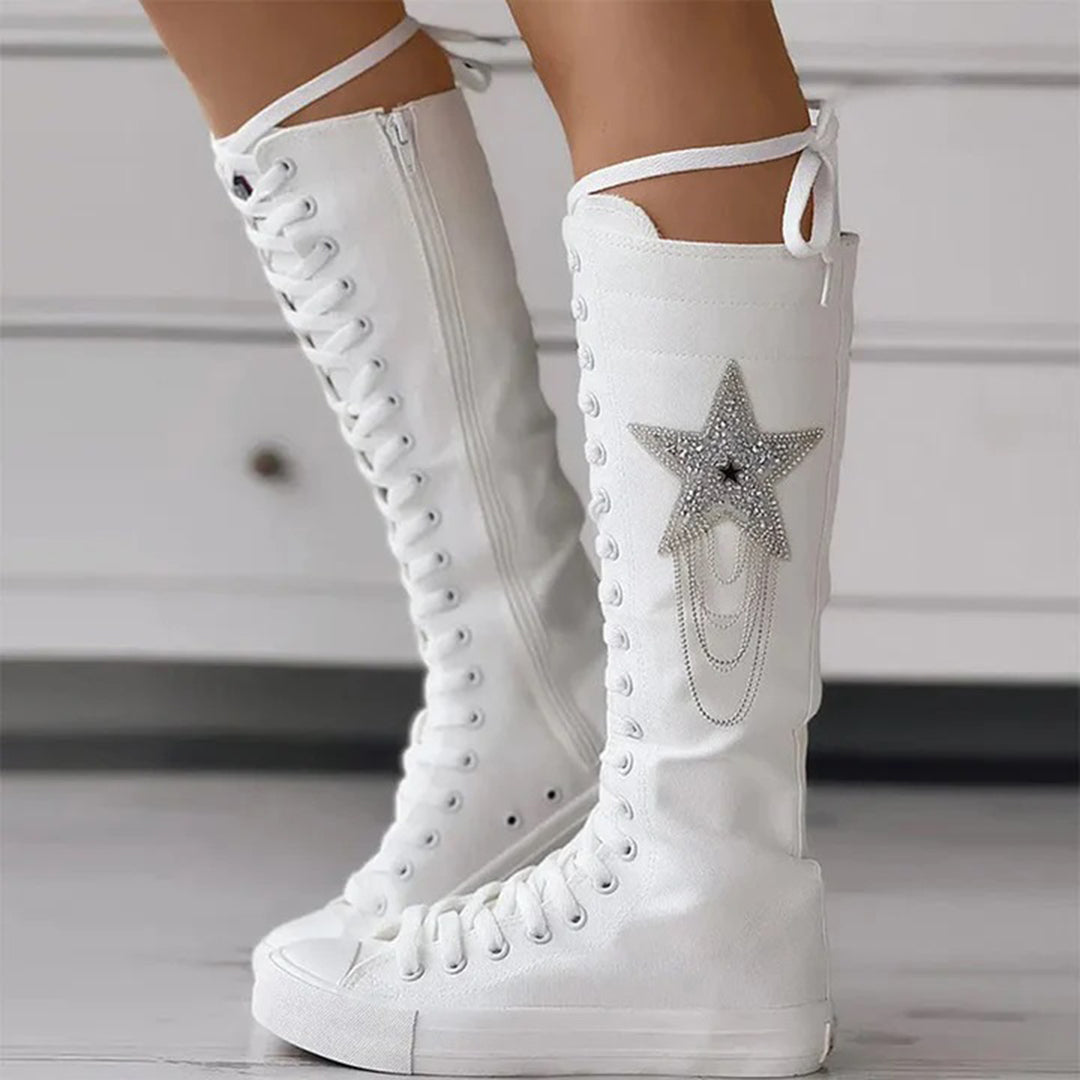 Fashionable women's boots: comfortable lace-up design & tassels for stylish winter footwear.