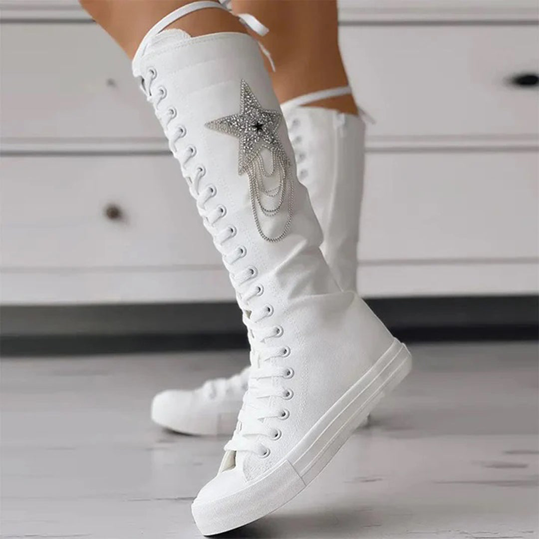 Stylish women's lace-up boots with unique tassel details, essential footwear for fall/winter.