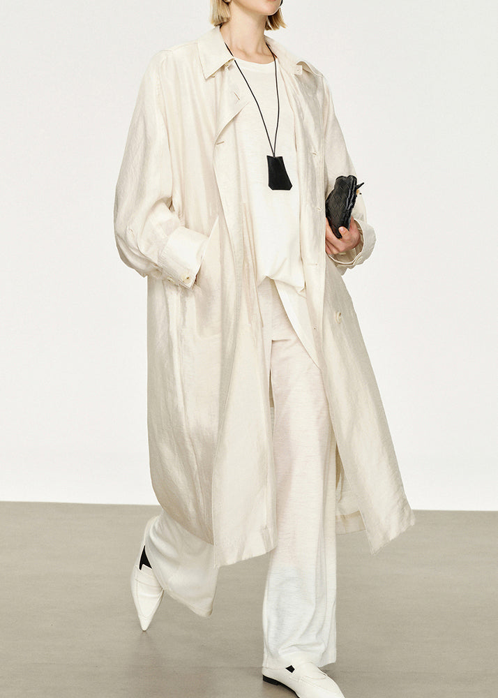 Elegant women's long trench coat with classic Peter Pan collar & stylish bat sleeves. Perfect for autumn chic.