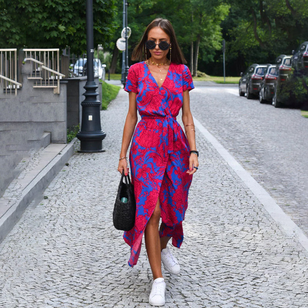 Women's elegant floral wrap midi dress with short sleeves, perfect for spring and summer events.