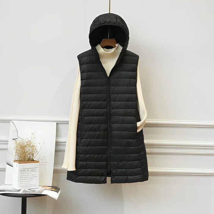 Versatile women's long sleeveless vest. Elegant layering jacket for a chic, all-season outerwear look.