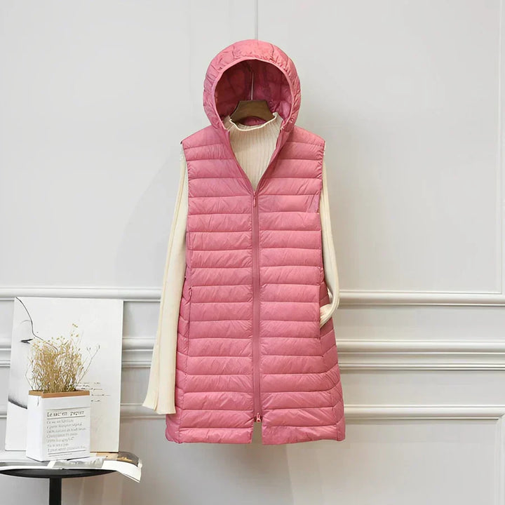 Fashionable pink long sleeveless vest. Elegant women's jacket for versatile layering & chic all-season style.