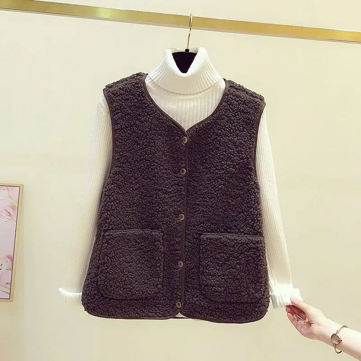 Women's V-neck sleeveless cardigan vest with pockets. Ideal casual layering for cool weather.