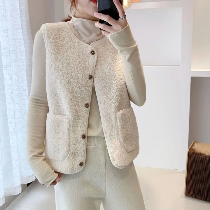 Comfortable women's button-front V-neck sleeveless cardigan vest featuring practical pockets.