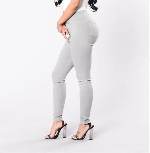 Elegant women's high waist skinny jeans, perfect for smart casual office wear. Versatile denim bottom.