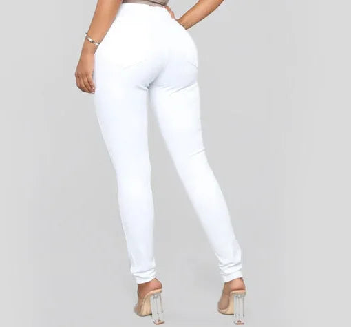 Classic blue high waist skinny jeans for women. Chic denim bottoms, ideal for office or casual wear.