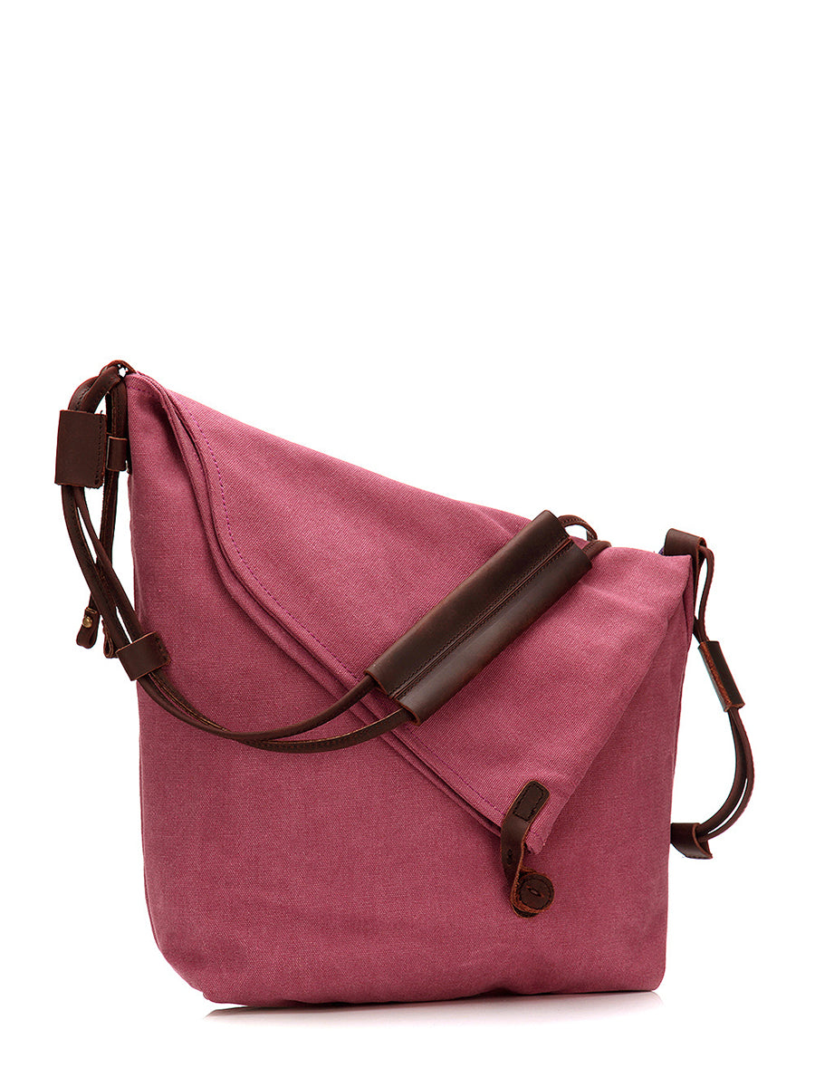 Everyday fashion accessory: women's slouchy shoulder bag with adjustable strap & button.