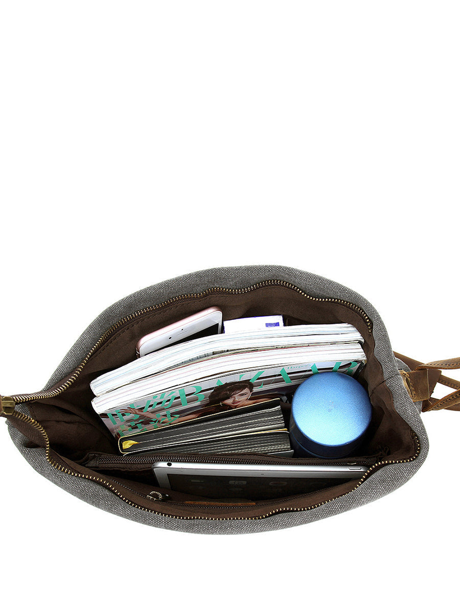 Stylish folded shoulder bag for women, featuring an asymmetrical slouchy design & button closure.