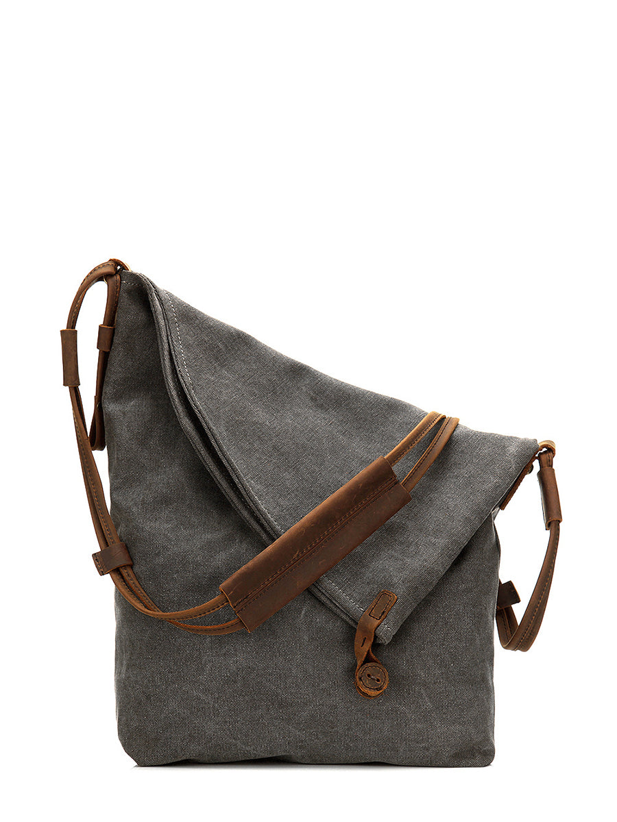 Women's fashion shoulder bag, a slouchy asymmetrical design with practical button closure.