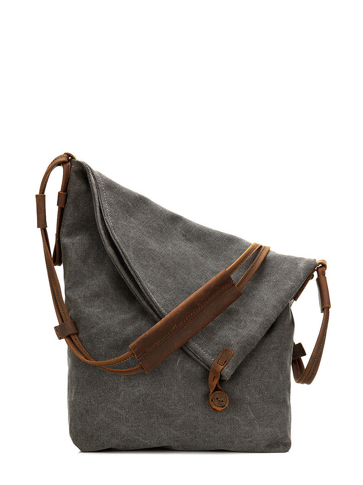 Women's fashion shoulder bag, a slouchy asymmetrical design with practical button closure.