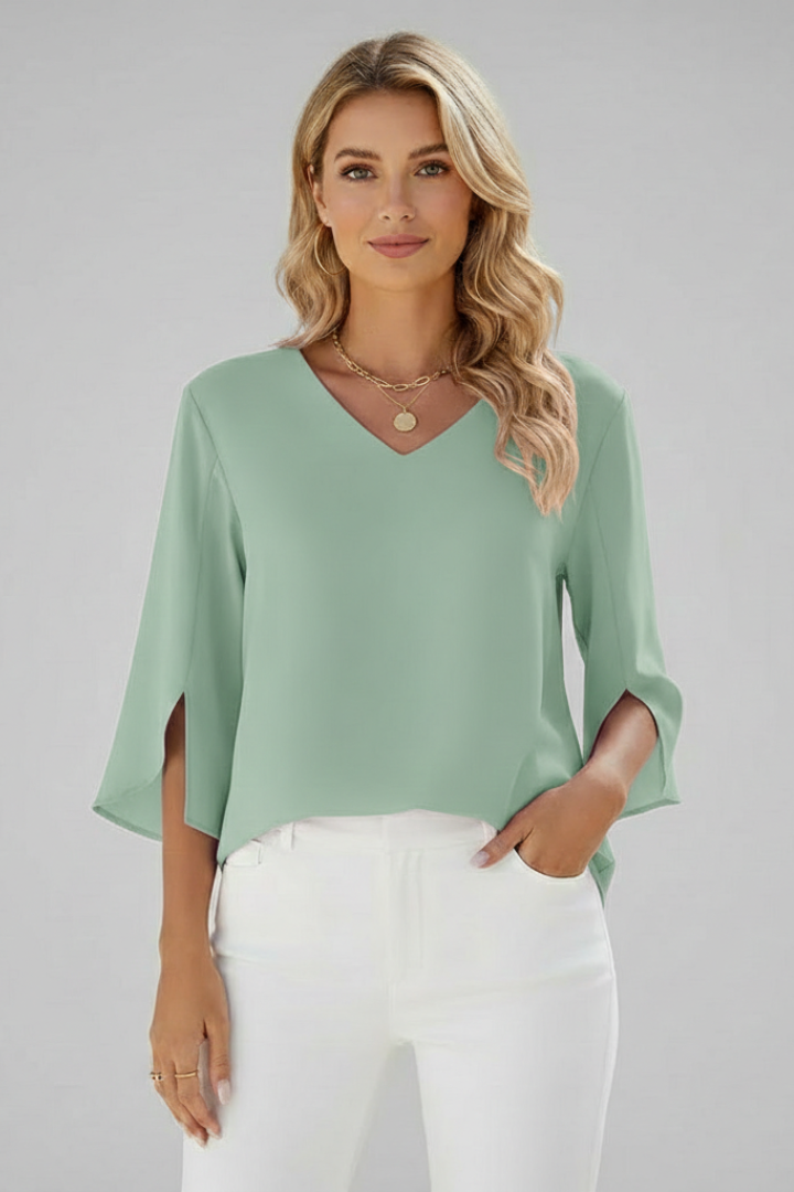 Versatile women's V-neck short sleeve pullover blouse with a pocket, suitable for casual or work attire.