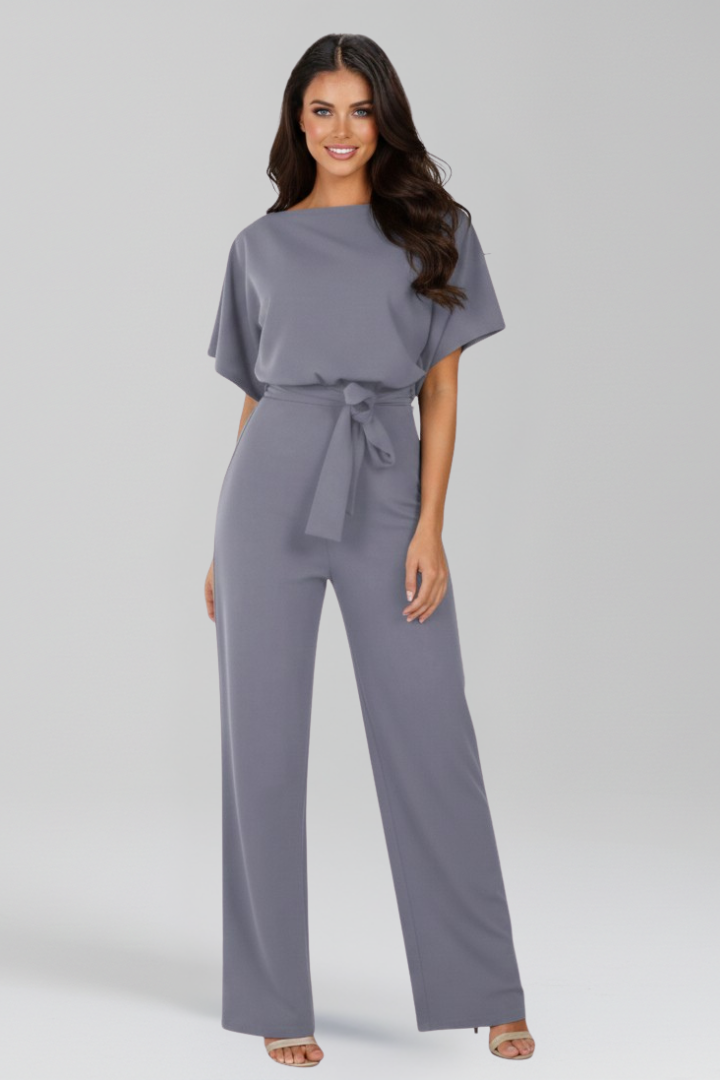 Modern women's summer jumpsuit, combining a wide-leg cut with a stylish tie-belt detail for fashion.