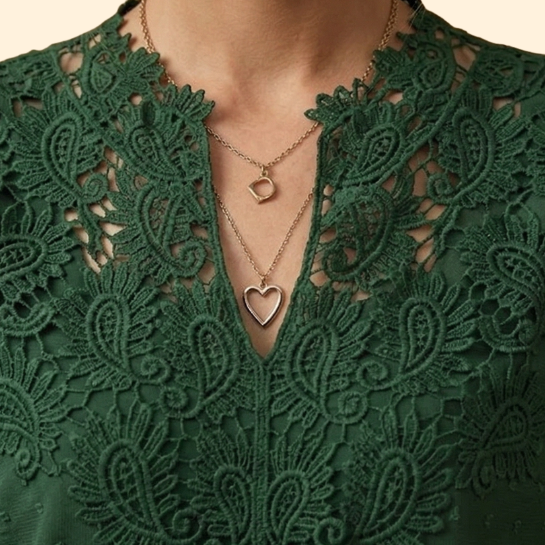Soft fabric women's blouse featuring exquisite lace detailing and intricate embroidery. Very stylish.