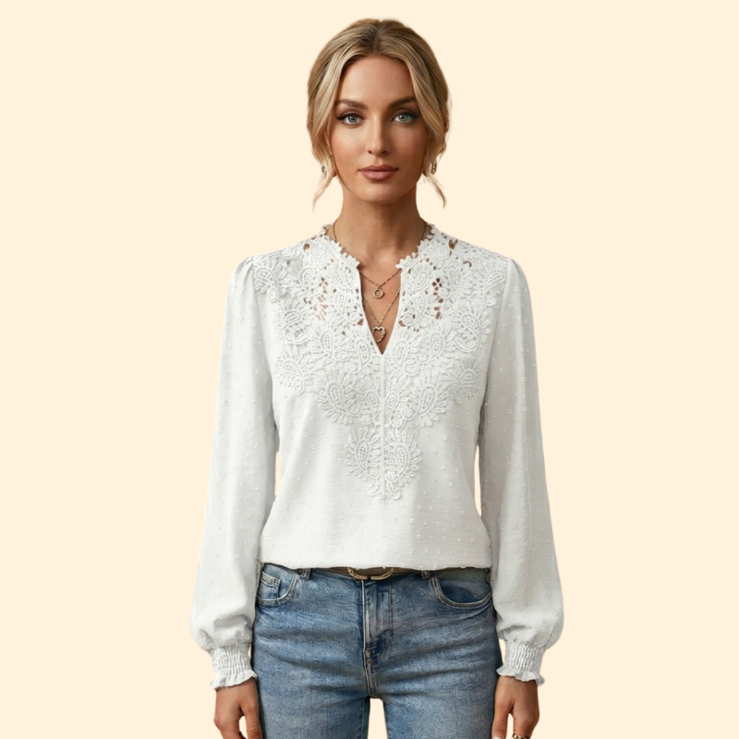 Elegant women's blouse featuring intricate lace and embroidery, a stylish and sophisticated ladies top.