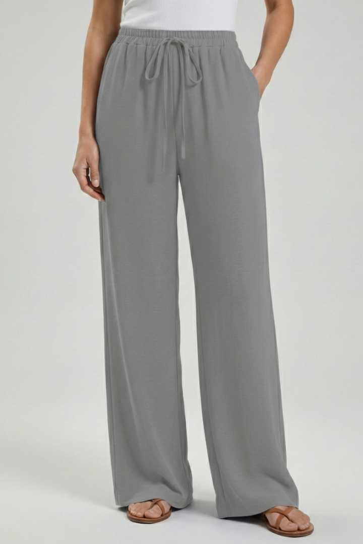 Women's wide-leg palazzo trousers, drawstring waist & functional side pockets.