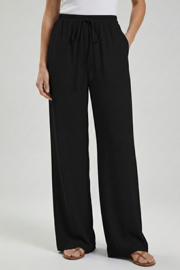 Elegant women's flowing palazzo trousers with wide leg, drawstring waist & practical side pockets.