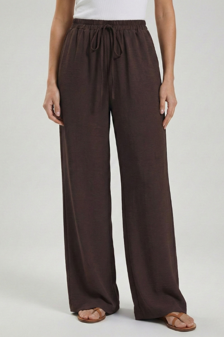 White women's palazzo trousers with drawstring & pockets. Breathable wide leg for summer.