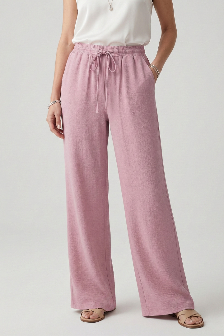 Stylish women's relaxed fit palazzo pants for vacation, featuring a comfortable drawstring waist.