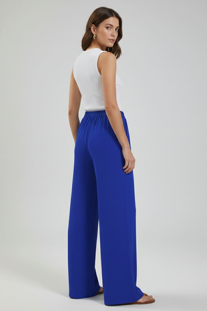 Soft, flowing palazzo trousers for women, featuring a drawstring waist & practical pockets.