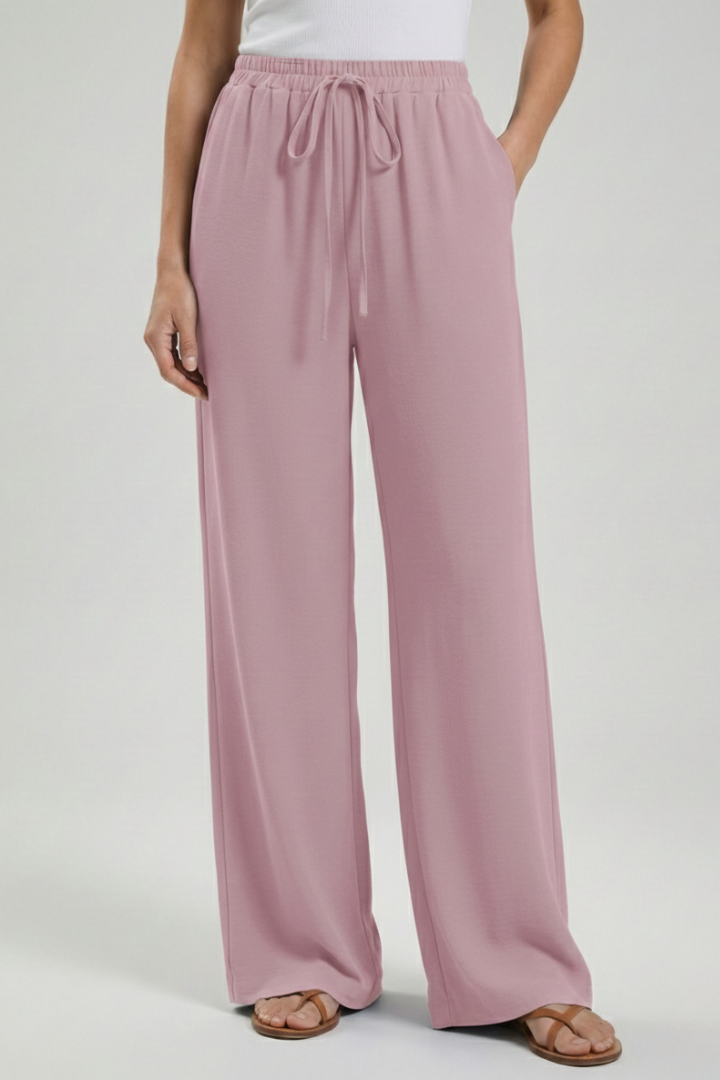 Black women's flowing palazzo trousers, drawstring waist & wide leg. Ideal for casual comfort.