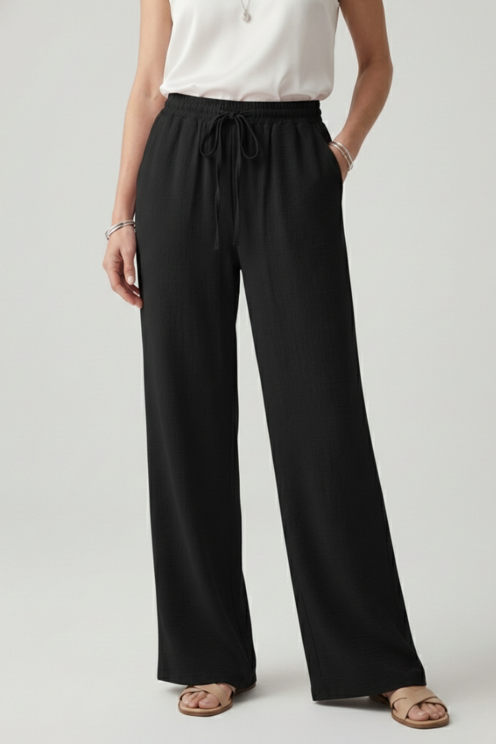 Casual women's summer trousers: wide leg palazzo design with a drawstring and convenient pockets.