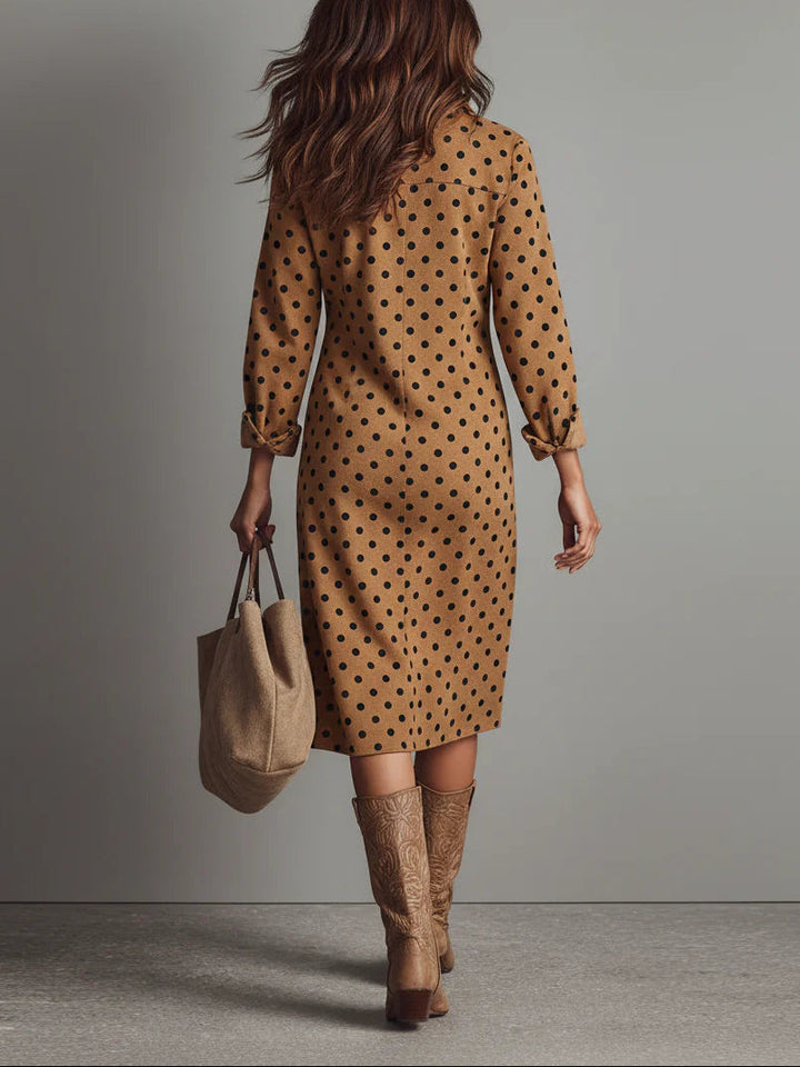 Chic women's button-down midi dress featuring a classic polka dot pattern. Perfect elegant day-to-night style.