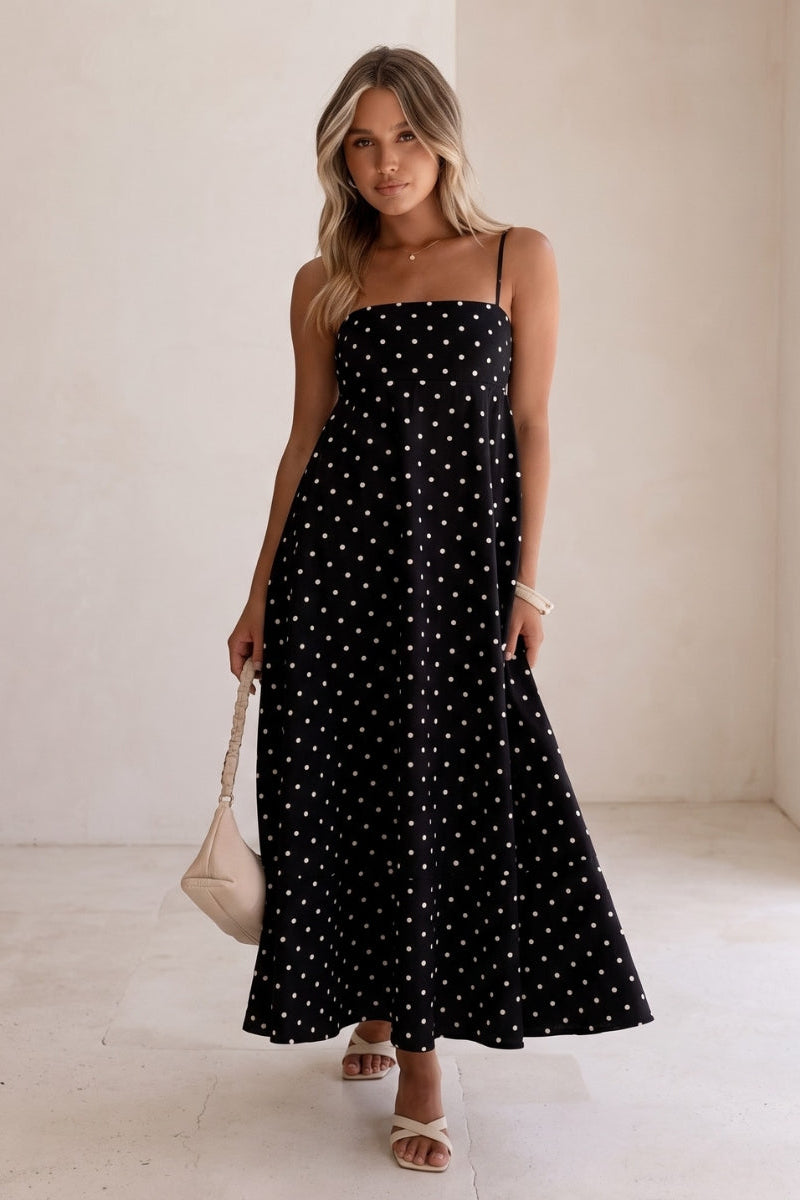 Versatile sleeveless polka dot maxi dress for women, flowy fabric, great for casual summer or elegant events.