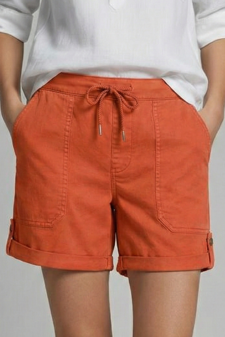 Woman enjoying summer in ladies' athleisure drawstring shorts, ideal for comfort & everyday wear.