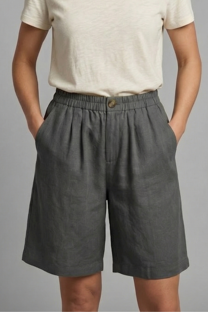 Mid-length women's casual shorts with a stretchy elastic waist and functional side pockets.