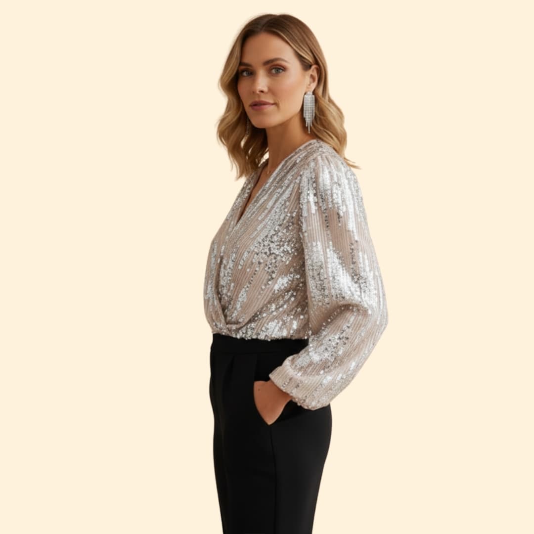 Elegant women's gold sequin wrap blouse with long sleeves and a flattering v-neck, suitable for evening wear.