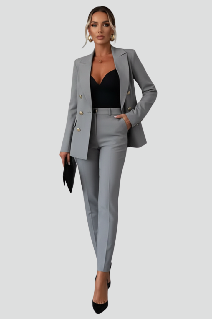 Front view of women's chic tailored blazer & trouser set. Professional elegant business attire for office wear.