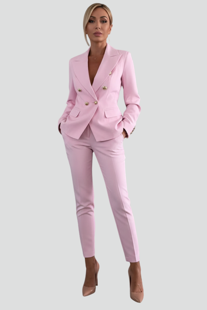 Woman models elegant tailored blazer & trouser set. Chic two-piece business attire for professional occasions.
