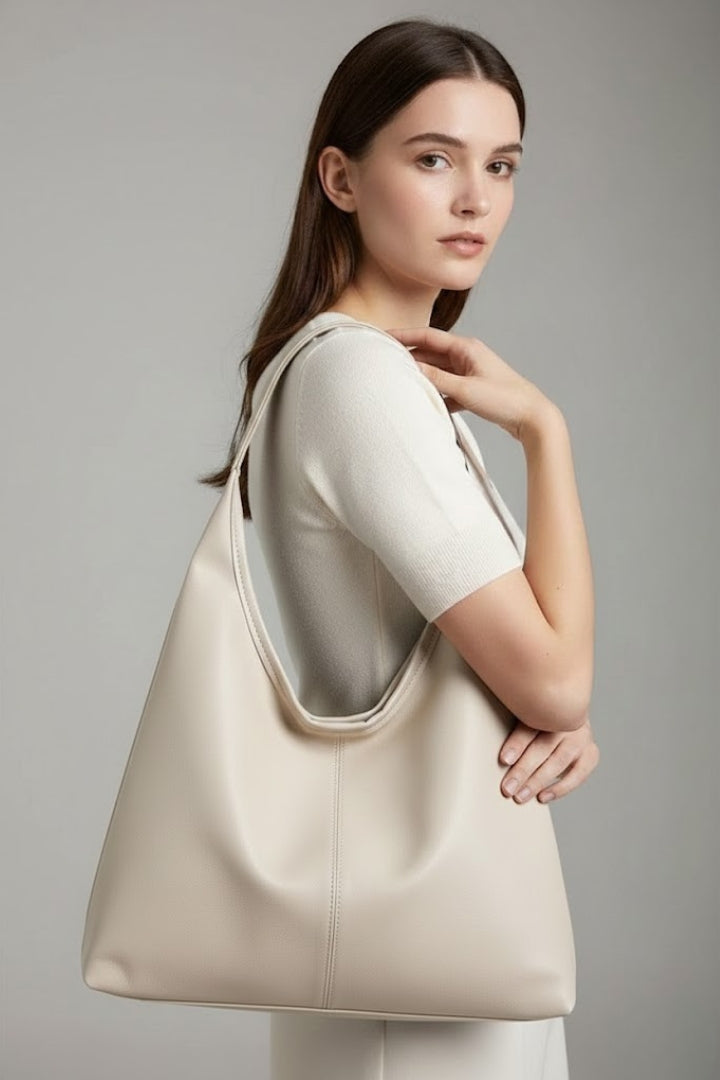 Elegant white faux leather tote bag, classic design, spacious for women's daily essentials.