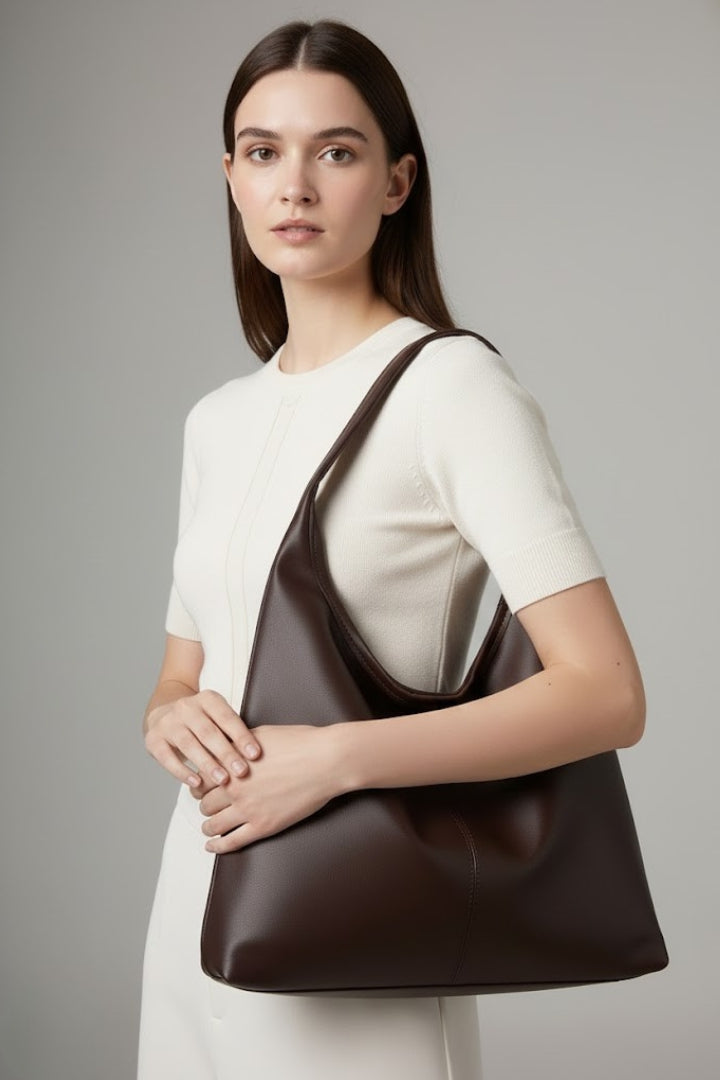 Spacious women's classic tote bag in coffee faux leather, a stylish and practical handbag.